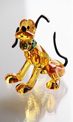 a golden dog figurine sitting on top of a table