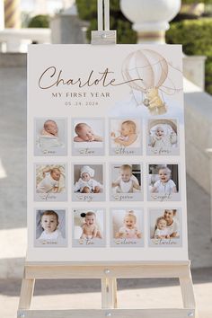 a baby's first year photo is displayed on a easel