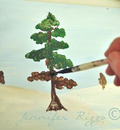 someone is painting a small tree with acrylic paint