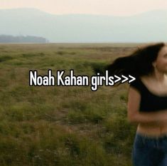 a woman walking across a field with the words noah kahan girls in front of her