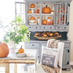 a dining room filled with furniture and pumpkins