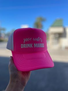 Stay cool and hydrated this summer with our Save Water Drink Margs Puff Hat in Neon Pink. Perfect for a day at the beach, this playful puff hat adds a touch of fun to your outfit while reminding you to stay hydrated. Cheers to summer! Cute Summer Baseball Cap, Cute Snapback Baseball Cap For Summer, Fun Summer Baseball Cap With Curved Brim, Cute Baseball Cap For Beach In Spring, Cute Baseball Cap For Beach Spring Season, Summer Snapback Trucker Hat With Upf 50+, Cute Pink Baseball Cap For Summer, Pink Summer Baseball Cap, Fun Pink Sun Hat For Vacation