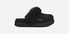 One of our favorite slippers, the Cozy, is lined with fluffy, soft wool and is super easy to slip on and off. It also features an ultra-light sole that travels both indoors and out, so your little one can wear it around the house, out to lunch, or around town on errands. This product was made in a factory that supports women in our supply chain with the help of HERproject. This collaborative initiative creates partnerships with brands like ours to empower and educate women in the workplace.The o Black Ugg Slippers, Slippers Kids, Women In The Workplace, Ugg Store, Black Uggs, Out To Lunch, Sheepskin Slippers, Kids Slippers, Kids Uggs