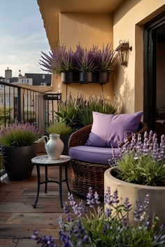 the balcony is decorated with potted plants and wicker furniture, along with lavender flowers