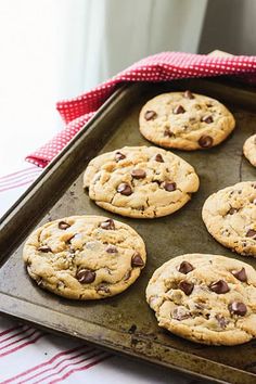 chocolate chip cookies on a baking sheet ready to be baked in the oven for christmas