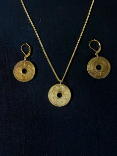 "Japanese 5-yen coins are polished bright and offered as a pendant & earring set.   The Japanese for \"five yen,\" go en (五円) is a homophone with go-en (御縁), \"en\" being a word for causal connection or relationship, and \"go\" being a respectful prefix. As a result, five-yen coins are commonly given as donations at Shinto shrines with the intention of establishing a good connection with the deity of the shrine. Several different interpretations of this \"luck\" exist depending on how many five Traditional Coin Shaped Good Luck Jewelry, Traditional Round Disc Jewelry As Gift, Round Coin Pendant Earrings For Gifts, Round Coin Pendant Earrings As Gift, Japanese Jewellery, Chinese Pendant, Pendant Earring Set, Green Tiger Eye, Japanese New Year