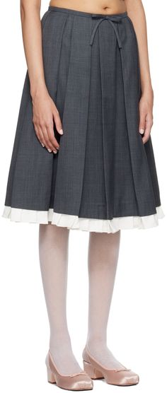 Polyester- and wool-blend delaine skirt. Box pleats throughout. · Bow accent at front waistband · Pleated stretch twill trim at hem · Concealed zip closure at side · Bonded jersey lining Supplier color: Gray Knee-length Wool Pleated Skirt, Wool Knee-length Pleated Skirt, Gray Pleated Skirt, Shushu Tong, Grey Pleated Skirt, Box Pleat Skirt, Pleat Skirt, Mid Length Skirts, Box Pleats