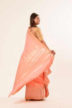 Discover the elegance of our Peach Katan Banarasi Silk Saree with intricate handwoven designs and a stunning gold temple border. Peach Silk Traditional Wear For Wedding, Peach Silk Traditional Wedding Wear, Peach Art Silk Traditional Wear For Wedding, Peach Raw Silk Traditional Wear With Zari Work, Traditional Peach Silk Wear, Peach Saree With Zari Weaving, Festive Peach Banarasi Silk Saree, Festive Peach Banarasi Silk Traditional Wear, Peach Saree With Zari Weaving For Diwali