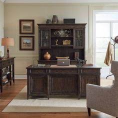 a living room filled with furniture and a large window