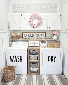 a white washer and dryer sitting in a laundry room