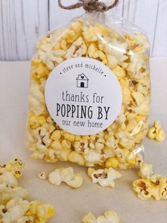 a bag filled with popcorn sitting on top of a table