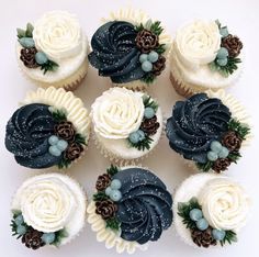 twelve cupcakes decorated with frosting and pine cones