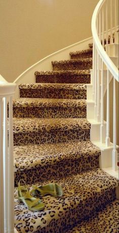 an animal print rug is on the stairs