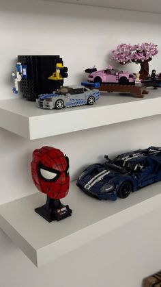 legos and cars are sitting on shelves in a room