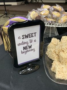 there is a sign that says sweet ending to a new beginning next to some desserts