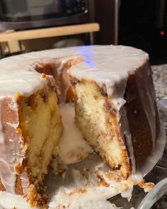 a cake that has been cut in half and is sitting on a glass platter