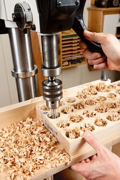 two people working on woodworking in a shop