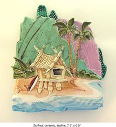 an ornament made to look like a hut on the beach with palm trees