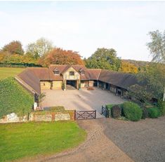 an aerial view of a large house in the countryside