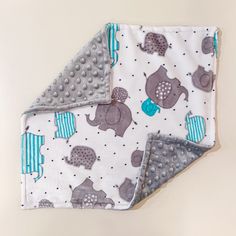 two baby blankets with elephants on them