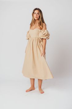 The Hamilton is everything you're looking for in a midi dress - charming, sophisticated, and absolutely flattering. It features premium quality details, like a sweetheart neckline and gorgeous balloon sleeves that can be worn on or off the shoulder. It's an unforgettable choice for every body type, and extra-comfy for expecting mamas! The best part? You can wear this beauty long after your sweet baby arrives! Available in multiple colorways. FIT: Runs true to size. Features a smocked back panel for comfort. This dress is roomy in the waist and will accommodate early maternity in your true size, but consider sizing up if you are in advanced pregnancy. MATERIAL: GARMENT DETAILS: Empire-waisted midi dress, with sweetheart neckline and statement balloon sleeves that can be worn on or off the s Midi Dress With Ruched And Fitted Bodice For Brunch, Off-shoulder Dress With Fitted Bodice For Brunch, Spring Off-shoulder Voluminous Dress, Summer Off-shoulder Voluminous Dress, Chic Off-shoulder Dress With Pleated Sleeves, Chic Voluminous Dress With Balloon Sleeves, Spring Voluminous Off-shoulder Dress, Summer Voluminous Off-shoulder Dress, Voluminous Off-shoulder Summer Dresses