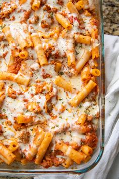 a casserole dish filled with pasta and sauce