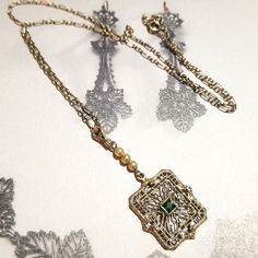 Stunning And Rare 1920s Art Deco Solid 10kt White Gold Lavaliere Necklace Featuring A Small Emerald (Most Likely Synthetic Which Was Extremely Common In This Style) And Genuine Natural Seed Pearls On The Gorgeous Filigree Lavaliere Drop. The Weight Is 2.71 Grams. The Paperclip Style Chain Measures 15.5" Long And The Lavaliere Drop Measures 1.5" Long. Everything Is In Rare Top Notch Condition. It's From A Kentucky Estate And The Owner's Name Was Eliza. I Have A Citrine Ring For Sale In My Closet From This Estate, Unless It Is Sold. This Is All The Information That I Have On This Item Except It's Just Really An Heirloom Quality Treasure That Is A Collectors Dream. Item F93. I've Been In Vinta 1920s Jewelry Aesthetic, James Patrick March, Art Deco Jewelry 1920s, 1920s Jewelry, Art Deco Emerald, Suite Life, James Patrick, Antique Green, Givenchy Paris