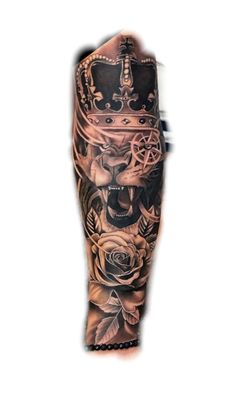 a man's leg with tattoos on it and roses in the middle, while wearing a crown