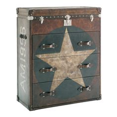 an old suitcase with a star painted on the front and sides, as well as two drawers