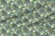 an image of a green and white fabric with houses in the background on a ruler