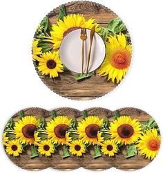 sunflowers are arranged on wooden plates with forks