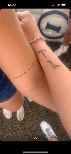 two people with tattoos on their legs and one has the words, i love you