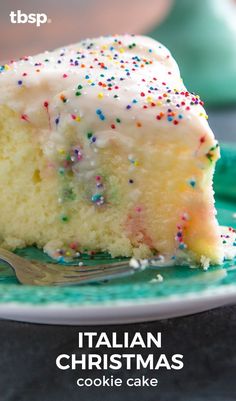 a slice of cake with white frosting and sprinkles on a plate