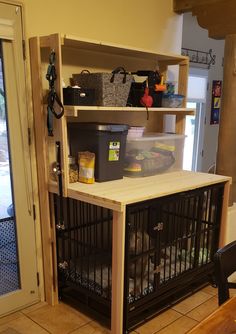 a dog cage is open on top of the counter