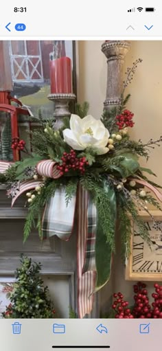 an image of a fireplace decorated for christmas with flowers and greenery on the mantle