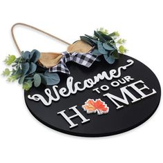 a sign that says welcome to our home with leaves on the front and an autumn theme