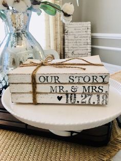 a couple of books sitting on top of a white plate