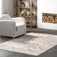 a living room with a white chair and wood stacked on top of each other in front of a fire place