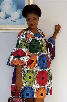 Ankara dress is a type of dress that is made from Ankara fabric, which is a colorful cotton fabric with various patterns and designs. Ankara fabric is also known as African wax print, Dutch wax, or African print1. Ankara dress is popular among African women, especially in Nigeria, Ghana, and other West African countries. Ankara dress can be worn for different occasions, such as weddings, parties, casual outings, and cultural events. Ankara dress can be styled in various ways, such as short dress Multicolor Midi Dress With Vibrant Print, Multicolor Abstract Print Midi Dress For Vacation, Multicolor Knee-length Dress With Vibrant Print, Multicolor Printed Knee-length Dress, Bohemian Multicolor Print Midi Dress, Colorful Pattern Multicolor Midi Dress, Bohemian Multicolor Pattern Midi Dress, Multicolor Floral Print Tunic Maxi Dress, Multicolor Printed Knee-length Mini Dress