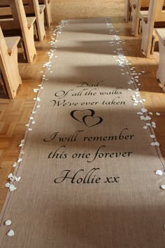 the aisle is decorated with white flowers and an inscription that reads, we are not alone