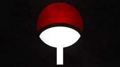 a red and white mushroom on a black background