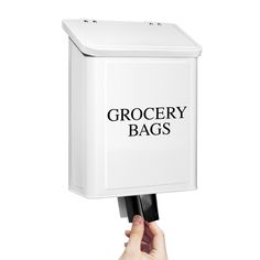 a hand holding a white box with the words grocery bags printed on it and black handles