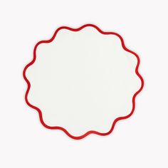 a white plate with red trim around it