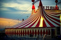 a large red and white striped circus tent