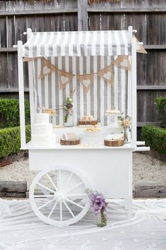 a white cart with some cake on it