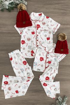 *Adult & child sets sold separately* Pajama set comes with a short sleeve top and matching pants White cookies & hot cocoa print fabric lends sweet, seasonal charm Soft fabric provides cozy, all-night comfort Perfect for bedtime or relaxing movie nights in Cozy up with some hot cocoa this season in our matching Cookies & Hot Cocoa Pajamas! These pajama sets come with a short sleeve button-up top and pair of matching pants. Both pieces are made from a soft fabric blend for comfortable wear, with Pajama Gift Basket Ideas, Cute Christmas Pjs, Maternity Christmas Pajamas, Christmas Family Pjs, Matching Christmas Pajamas Family, Baby Christmas Pjs, Christmas Matching Pajamas, Kids Christmas Pajamas, Fall Pajamas