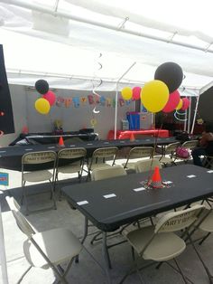 tables and chairs are set up for a birthday party