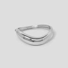 Our wave hinged bangle has a simple click closure & features a fluid, tapered design with a seamlessly sleek finish. Made with Rhodium plated recycled brass. Outside diameter 75mm x 72mm.  Inside diameter 67mm x 57 mm. Statement Cuff Bracelet, Gold And Silver Bracelets, The Bangles, Silver Bangle, Hinged Bangle, Body Jewellery, Silver Bangles, Bracelet Gift, Gold And Silver