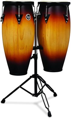 two conga drums sitting on top of a tripod with black legs and an orange ombrephant