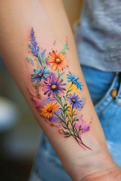 a woman's arm with flowers painted on it